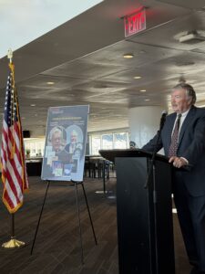 John farmer speaker at podium